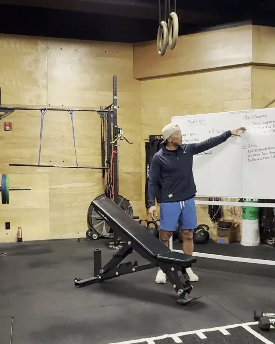 Matt Arnold teaching in front of a whiteboard