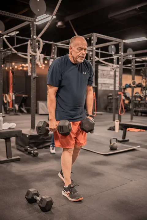 A man tying his shoe before a workout